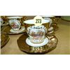 Image 2 : group of gold plated cups and saucers with people