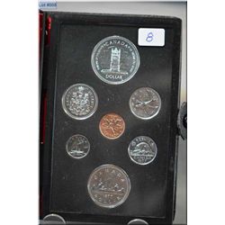 1977  25th anniversary set with commermorative silver dollar depicting the throne of the senate of C