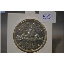 1951 Canada silver dollar coin in protector