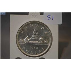 1952 Canada silver dollar coin in protector