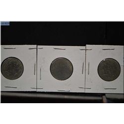 Five Canadian silver quarters