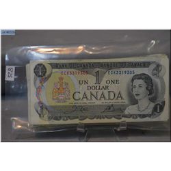 Stack of thirty two Canadian one dollar bills