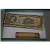Image 1 : Canadian two dollar bill, one dollar bill, twenty dollar bill and a roll of nickels