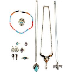 Collection of jewelry includes figural face
