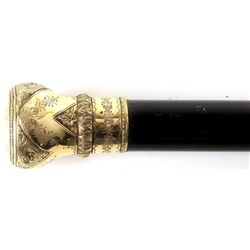 Gentlemen"s walking stick the gold handle engraved