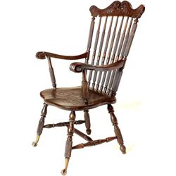 Antique mahogany chair with glass ball and claw