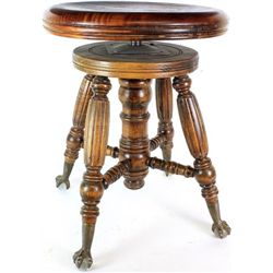 Antique piano stool in mahogany on glass