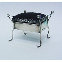 Sterling Silver Piano Stool Pin Cushion, 1909.