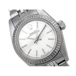 Lady's Rolex Stainless Steel Oyster Perpetual Watch. Silver Dial. 18k White Gold Fluted Bezel. Stain