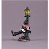 Image 1 : Hand painted cast iron figurine of man swinging on lamp