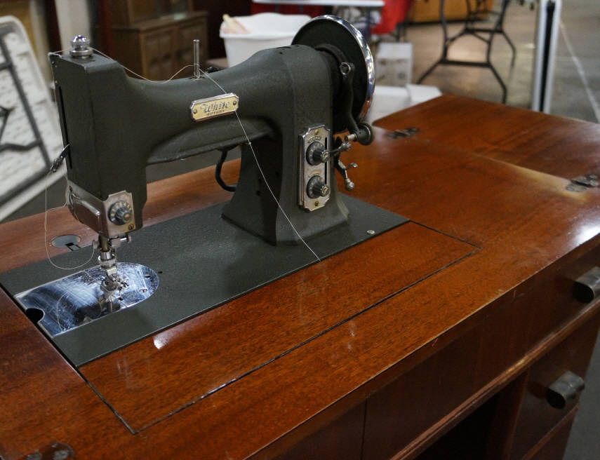 White Rotary Electric Sewing Machine In Cabinet.