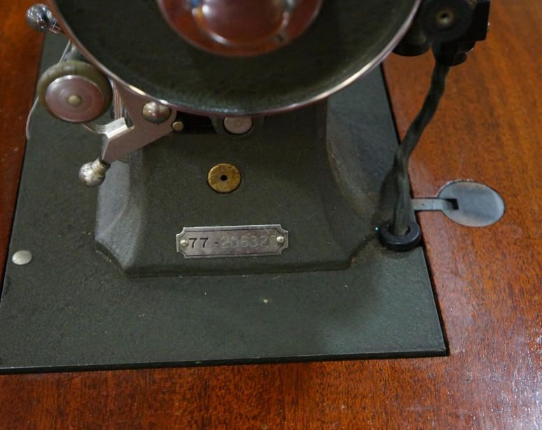 White Rotary Electric Sewing Machine In Cabinet.