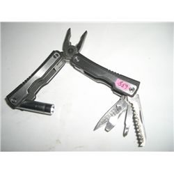 LEATHERMAN TYPE OF KNIFE WITH FLASHLIGHT THAT WORKS AND PLIERS!! KNIFE CAME OUT OF SAFE!!