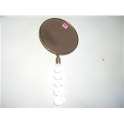 VINTAGE BRASS MIRROR WITH GLASS HANDLE AND FLOWER DESIGN ON BACK OF MIRROR!! MIRROR CAME OUT OF SAFE