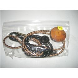 BAG CONTAINING 2 BOLO TIES *1 IS MADE FROM ELKHORN & 2ND LOGO*!! ITEM CAME OUT OF SAFE BOX!!