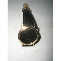 DIAMOND WATCH IN LIKE NEW CONDITTION WITH BALCK FACE & LEATHER BAND!! WATCH CAME OUT OF SAFE BOX!!