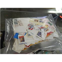 BAG OF ASSORTED COLLECTABLE AND OTHER STAMPS