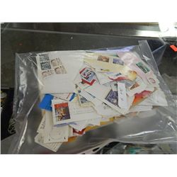 BAG OF ASSORTED COLLECTABLE AND OTHER STAMPS