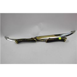 PAIR OF WOOD AND BRASS HANDLED SWORDS