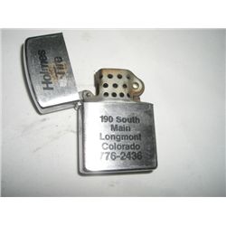 VINTAGE *JAPAN* LIGHTER ADVERTISING *HOLMES TIRE-LONGMONT,CO*!! LIGHTER CAME OUT OF SAFE!!
