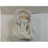 Image 1 : SMALL PORCELAIN MUSIC BOX BABY DOLL IN WICKER CRAD