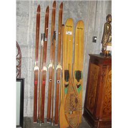 GROUP LOT OF VINTAGE SKIIS; CROSS COUNTRY AND WATER SKIIS, PAIR OF SNOW SHOES AND A WOODEN PADDLE