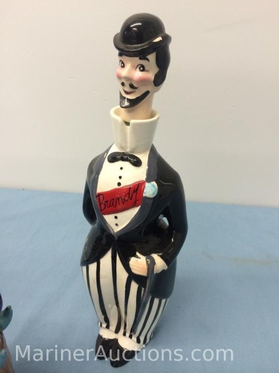 Three vintage figural liquor decanters