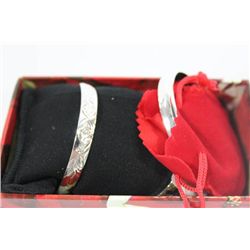 PAIR OF STERLING SILVER ETCHED BRACELETS