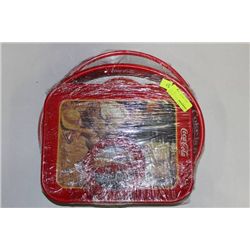 STACK OF COCA COLA COLLECTOR TRAYS