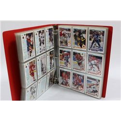 RED BINDER FULL OF 1990 UPPER DECK HOCKEY CARDS