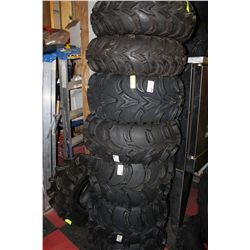 STACK OF 8 ASST. SIZED QUAD TIRES SOLD W/2 RIMS