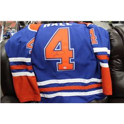 TAYLOR HALL SIGNED OILERS JERSEY W / COA