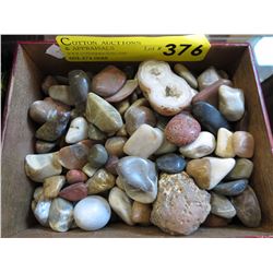Box of tumbled and polished rocks