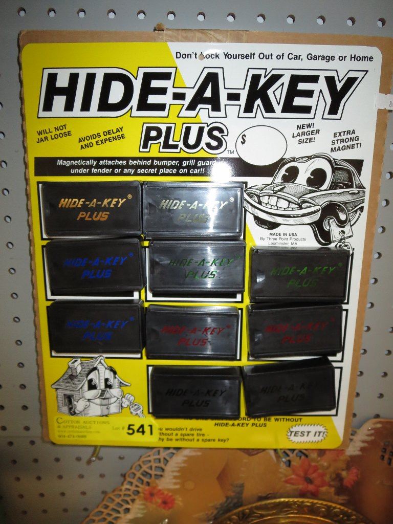 Hide-A-Key boxes on metal display plate