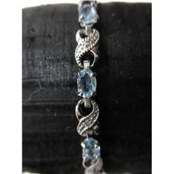 Blue Topaz & Diamond figure 8 tennis bracelet