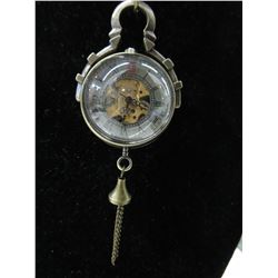 Unusual 1" dia. mechanical glass time-piece