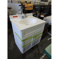 Bathroom sink on cupboard with faucets