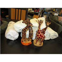 10 Carved wood kissing giraffe statues
