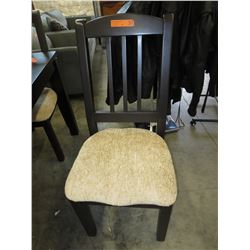 4 Solid dining chairs with upholstered seats.