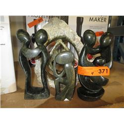 4 Carved stone statues