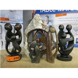 5 Carved stone statues