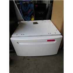 White laundry machine pedestal