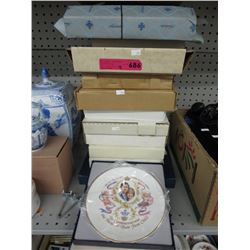 12 Collector plates in boxes.