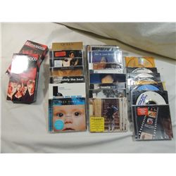 LOT 29 ASSORTED NEW CDS & VHS