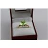 Image 1 : LADIES 10KT YELLOW GOLD SYNTHETIC GREEN SPINEL DRESS RING CLAW SET WITH 1 OVAL MIXED CUT GREEN
