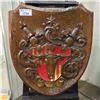 Image 1 : HAND CARVED WOODEN FAMILY CREST FEATURING BULL AND BELLS
