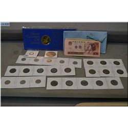 Selection of collectible currency and coins including foreign bills, Canadian Oil Sands token, Ameri