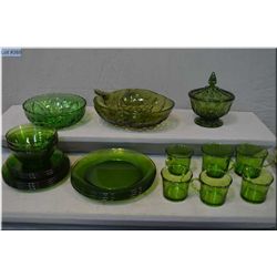 Selection of vintage bottle green glassware including embossed and lidded candy dish, grape motif bo