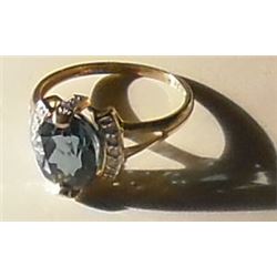 Faceted beautiful blue stone with diamonds gold ring on sterling