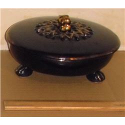 dark blue covered bowl